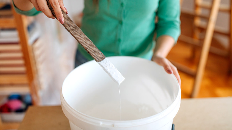 woman mixing paint