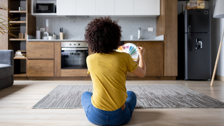 Woman picking paint swatches