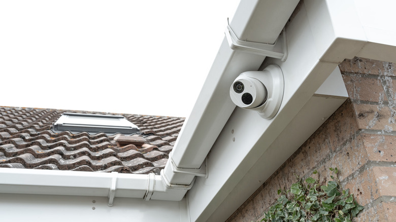 Security camera mounted under the gutter of a home