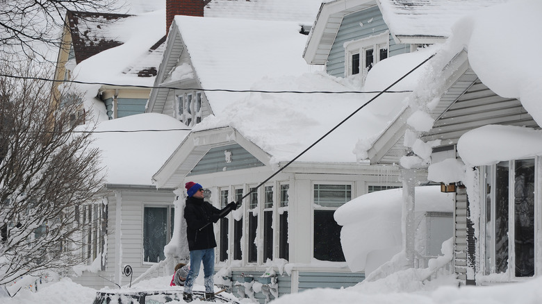 removing snow from roof
