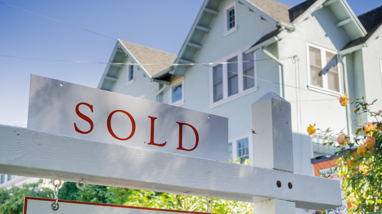 house with sold sign