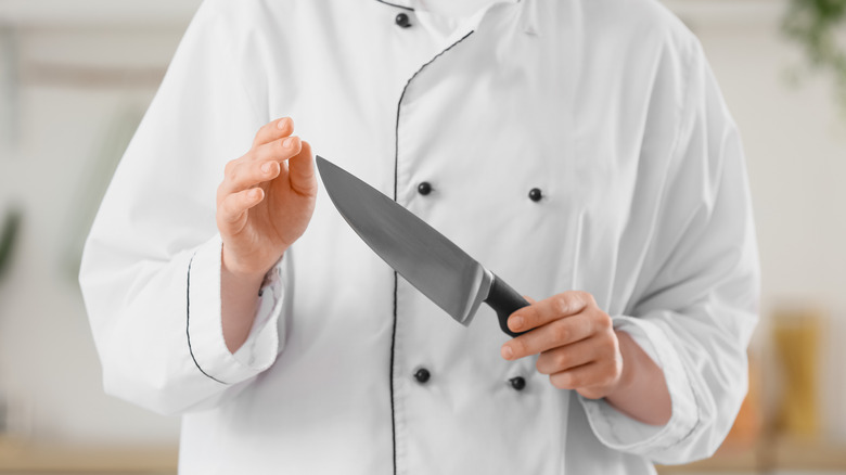 a person holding a knife