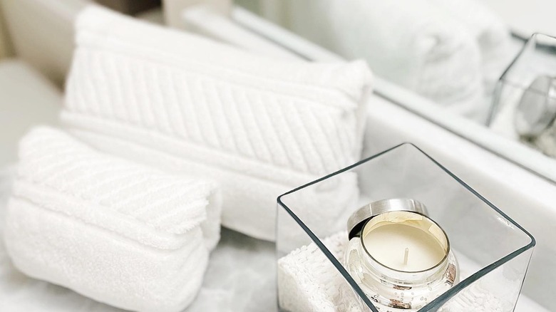 White towels ranger rolled on counter