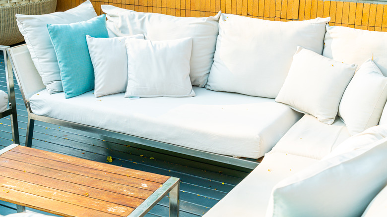 white outdoor couch with pillows 