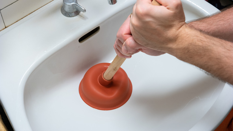 Using a sink plunger
