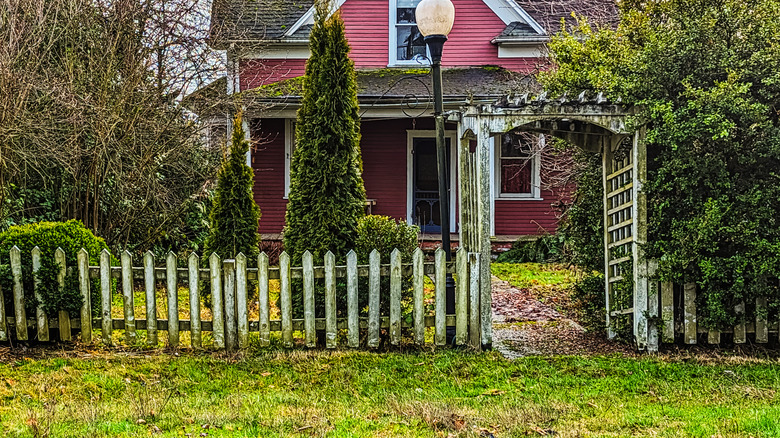 An old fence in front of a house