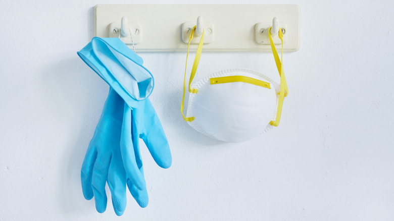 Rubber gloves and mask hanging for hooks