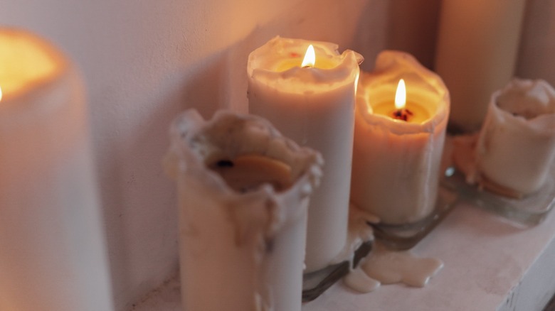 melted candles against a wall