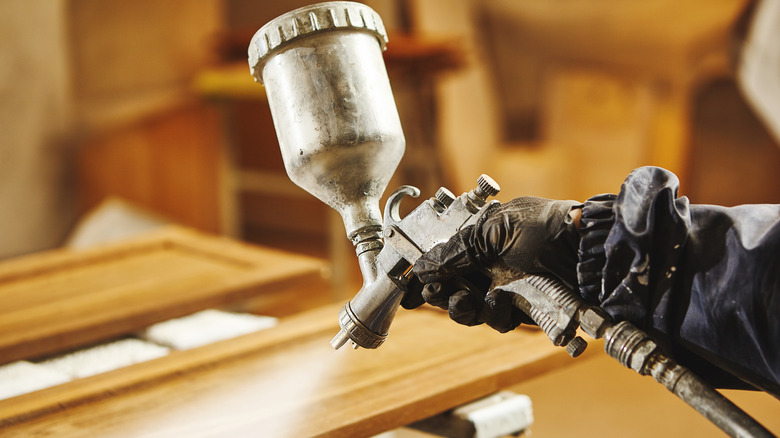 Painting with a sprayer onto wood