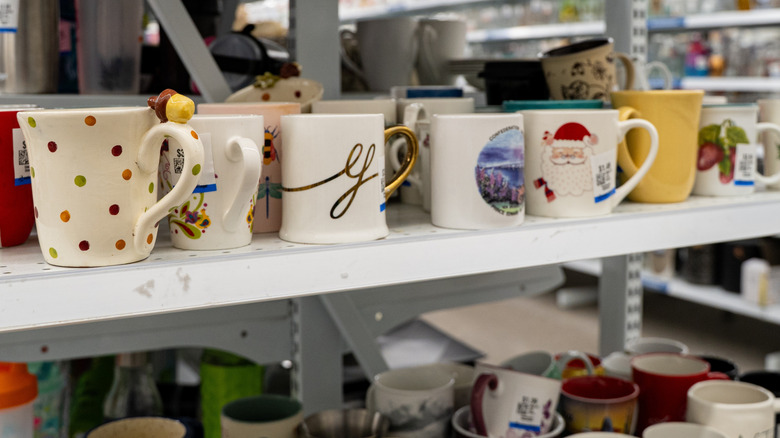 thrift store aisle with mugs