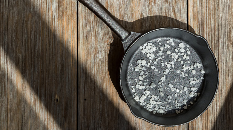 A cast iron skillet with salt inside