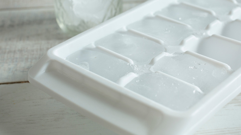An ice cube tray on a wooden floor or worktop