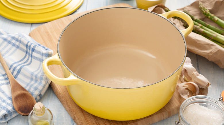 A yellow enameled cast iron dutch oven