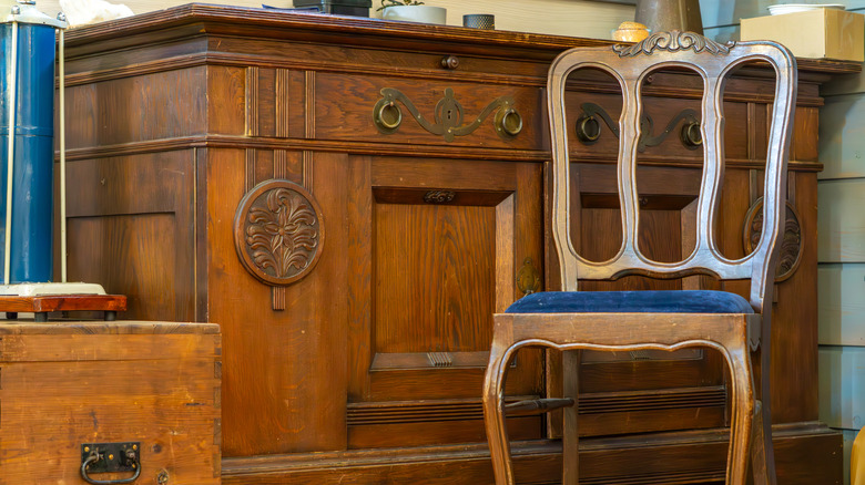 Vintage wood desk, chest, and chair with orange hues