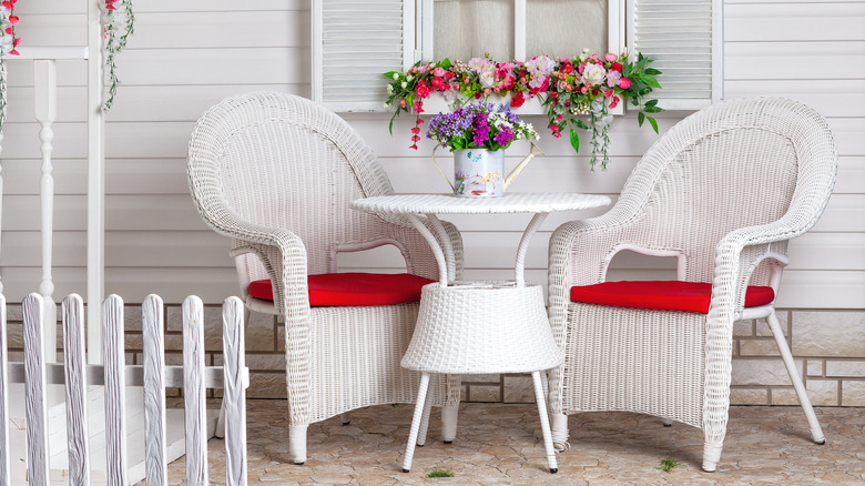 white wicker chairs and table