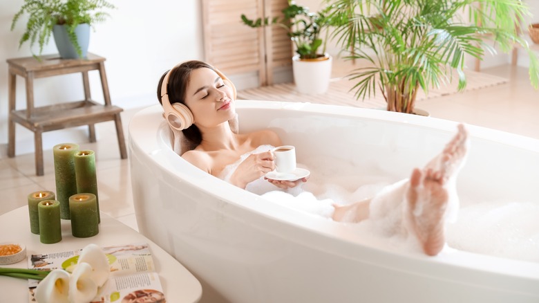 woman relaxing in bathtub