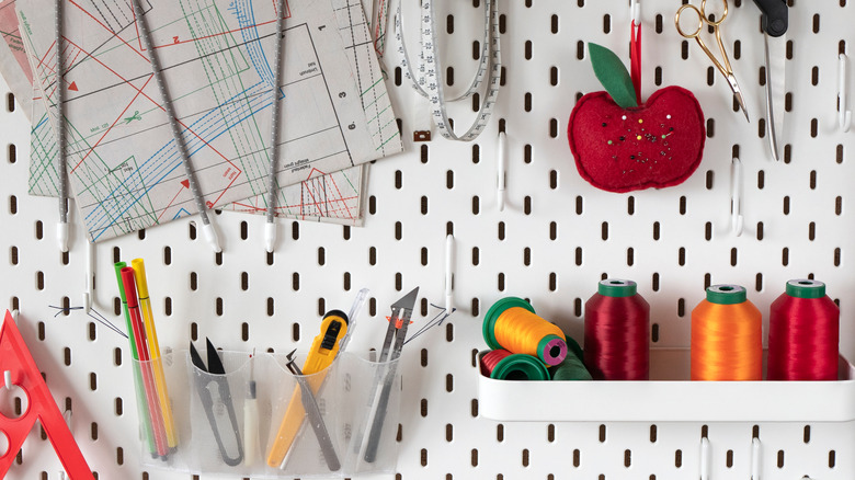 pegboard with sewing supplies
