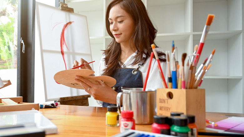 woman working on art