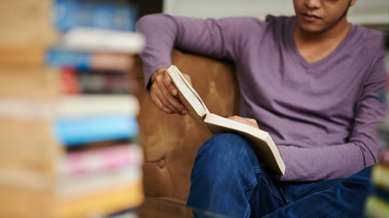 man sitting and reading