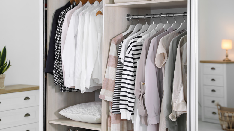 Clothes hanging in a closet