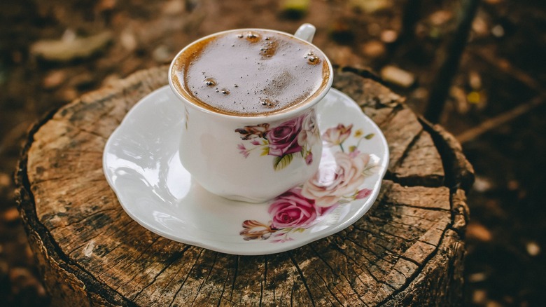 teacup on a tree stump