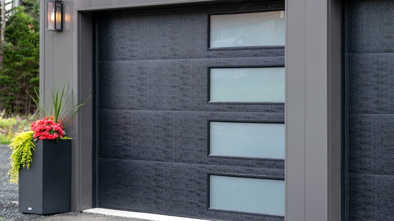 modern black garage door with frosted glass panels