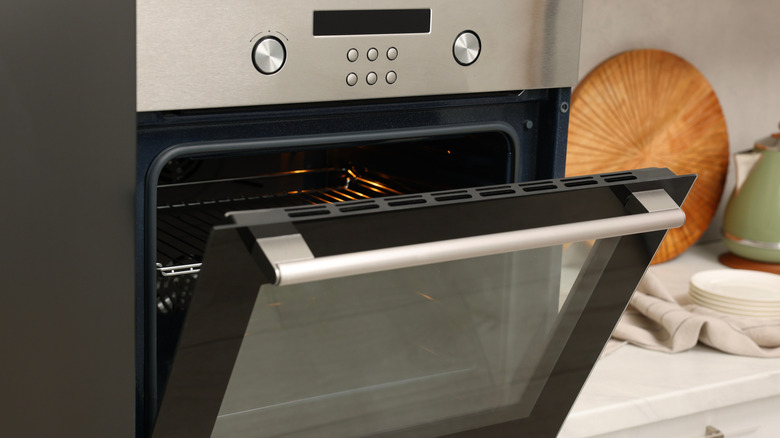 Open electric oven in kitchen