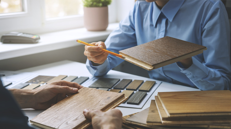 People choosing wood flooring samples