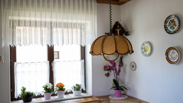 Amber and copper floral shaped chandelier in a vintage design scheme.