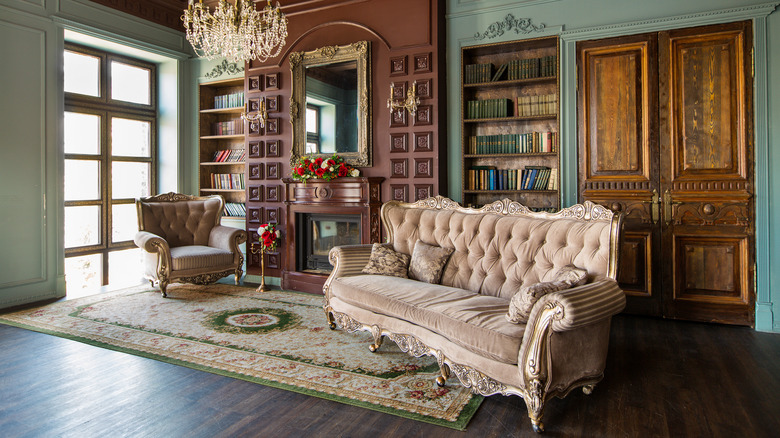 ornate living room with mirror