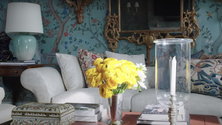 floral wallpaper over sofa