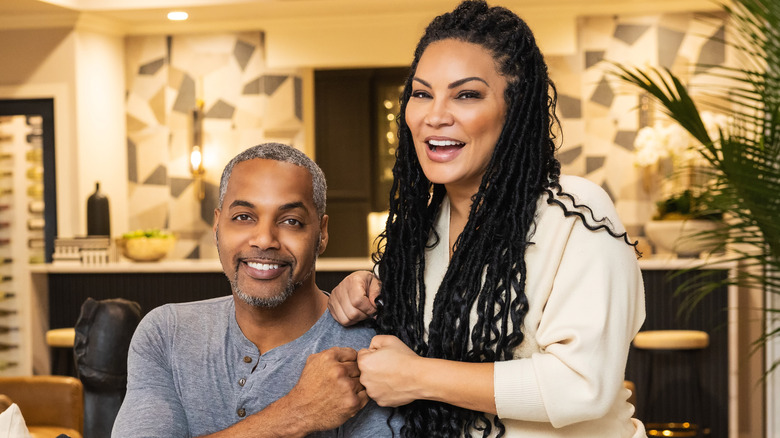 Egypt Sherrod and Mike Jackson laughing and fist-bumping