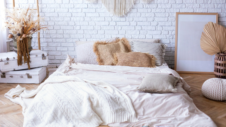 A decorated room with a floor mattress.