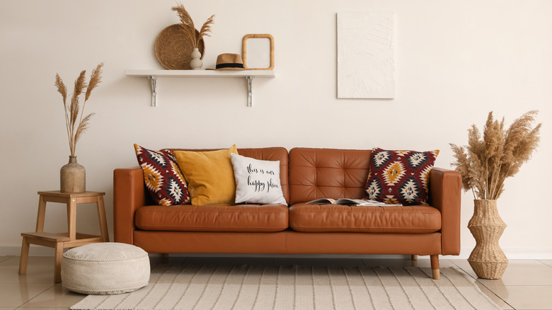 A leather couch complemented with other accessories