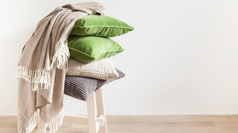 pile of cushions and blankets 
