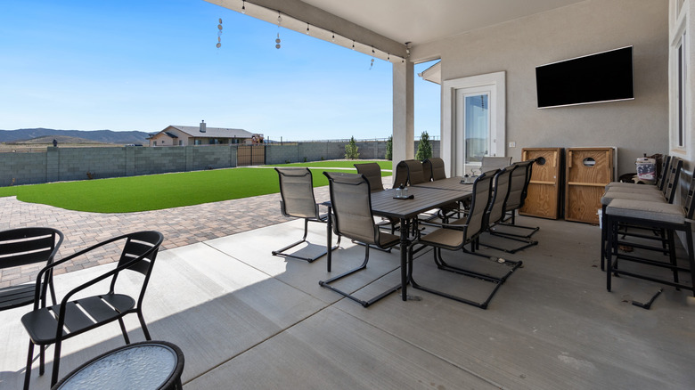 Outdoor lounge area with a TV