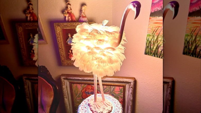 A flamingo light with real feathers