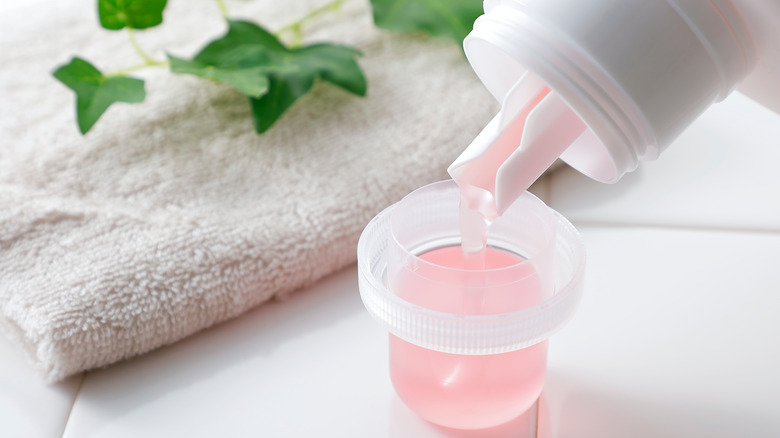 Pink liquid laundry detergent