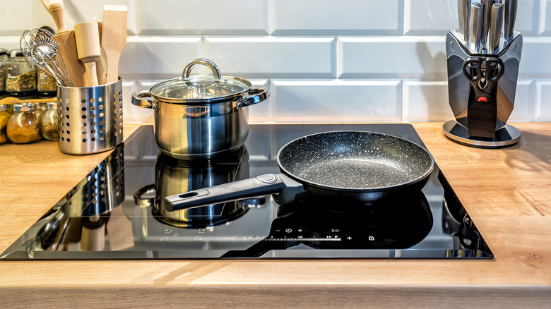 A pot and a pan on an induction stove