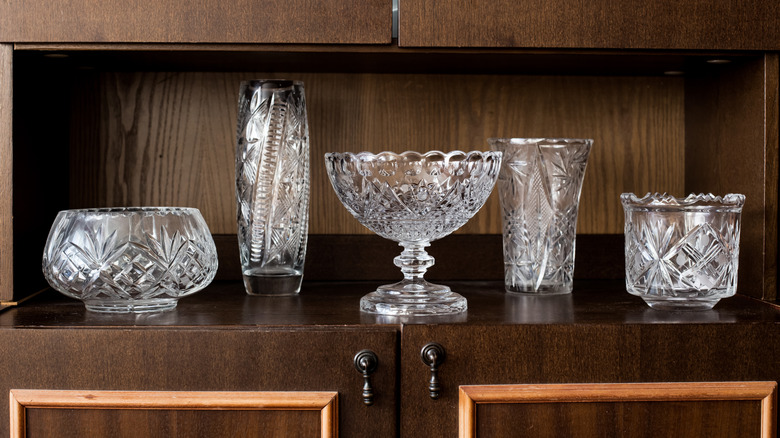 Shelf with a collection of vintage crystal vases
