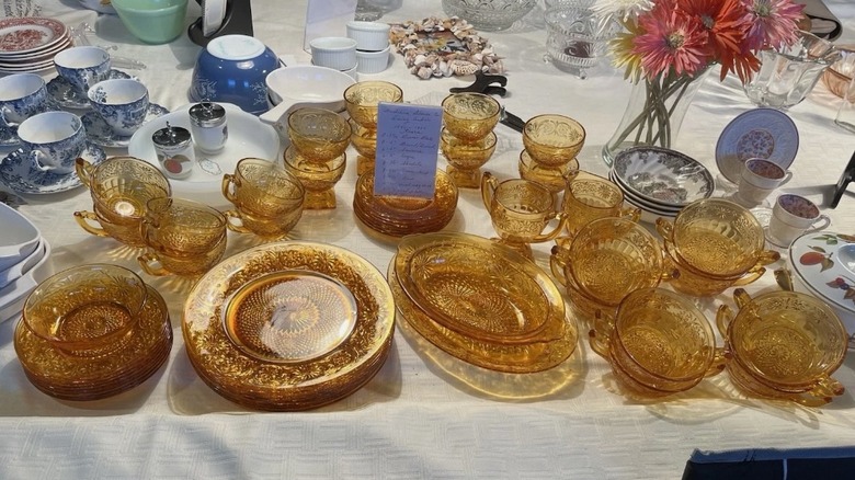 set of amber colored Depression glass on a table