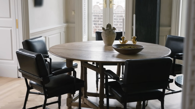 Nate Berkus and Jeremiah Brent's dining room with an antique table and chairs
