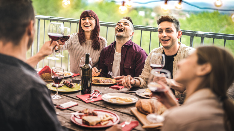 People laughing at backyard party