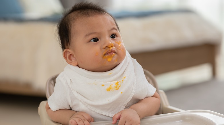 Messy baby looking up