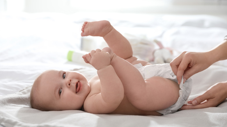 Baby getting diaper changed
