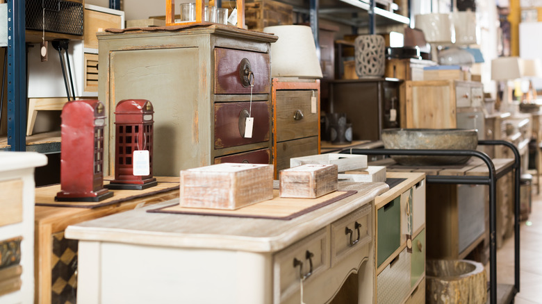 vintage desk in thrift store aisle