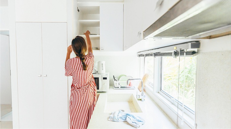 Person in white kitchen