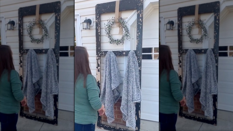 Repurposed old door into towel holder in bathroom.