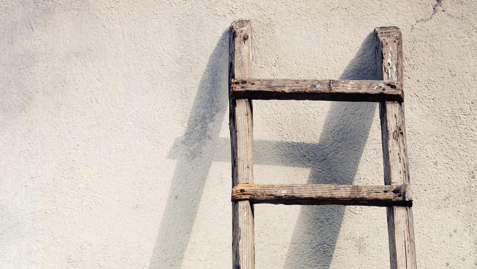 How To Turn An Old Ladder Into A Stylish Coat Hanger