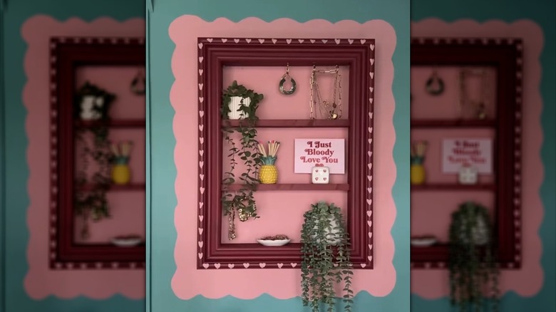 A red frame that's been turned into a wall shelf